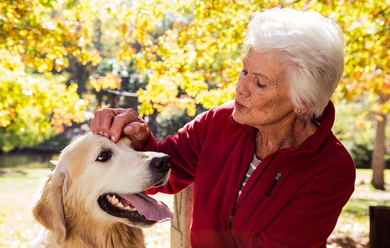 elderly-woman-sitting-with-dog-636096716_5760x3840.jpg