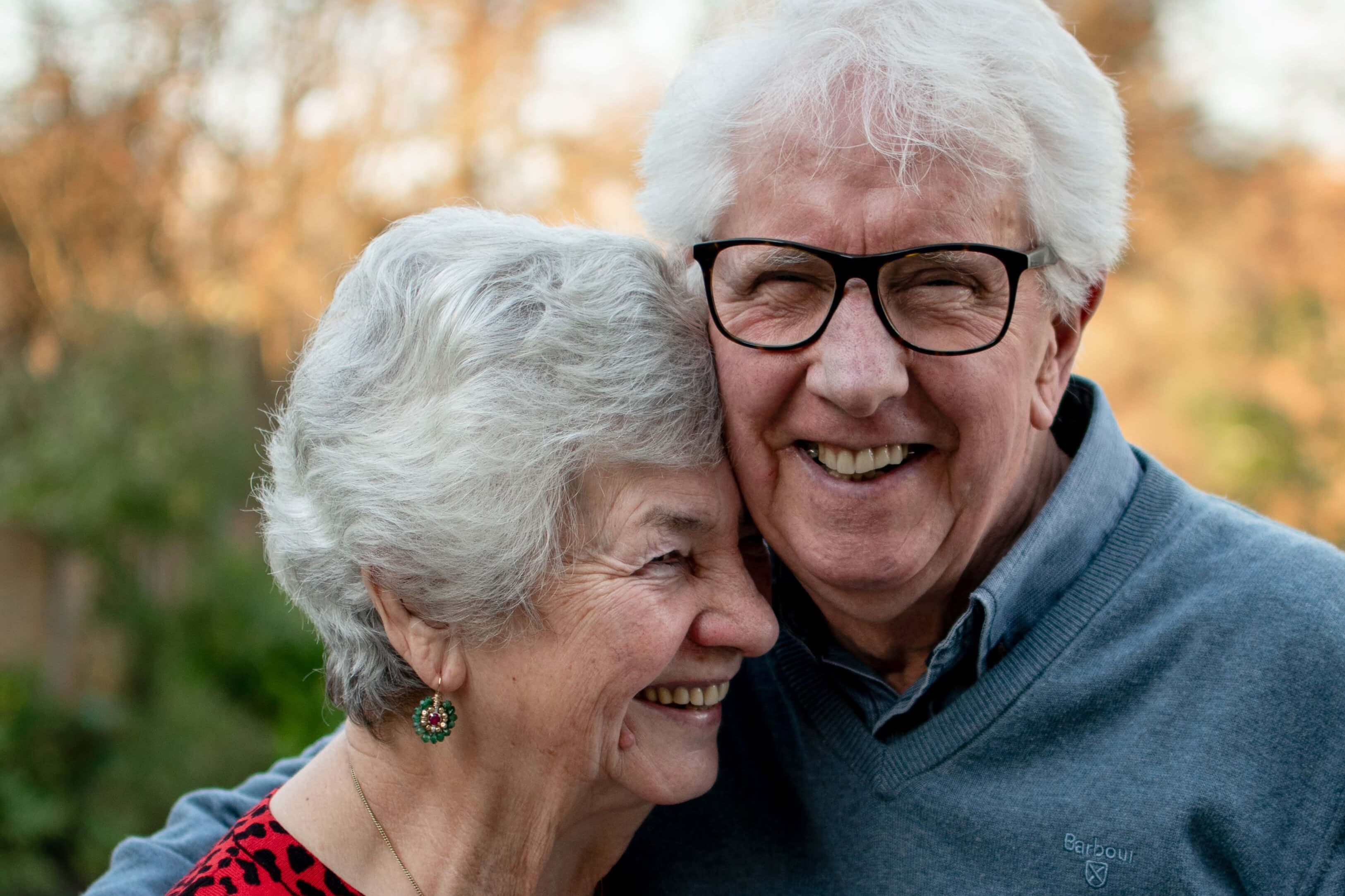 Older couple embracing outdoors