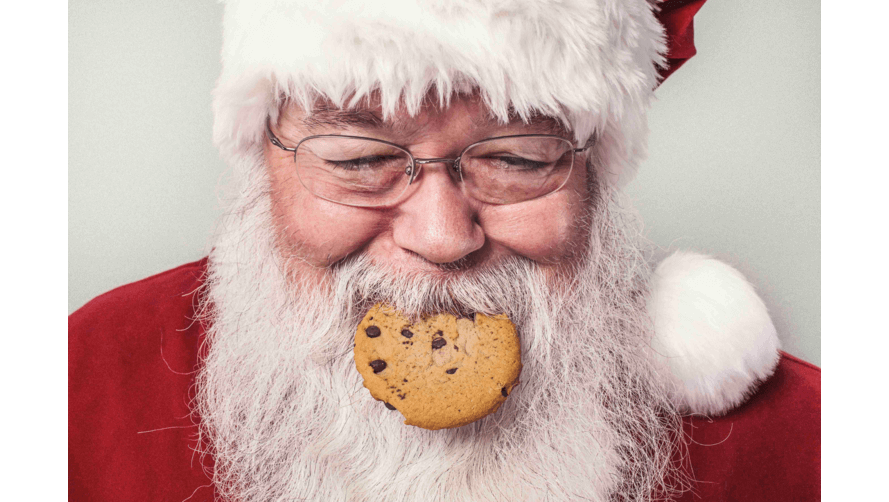 Santa eating a choc chip cookie
