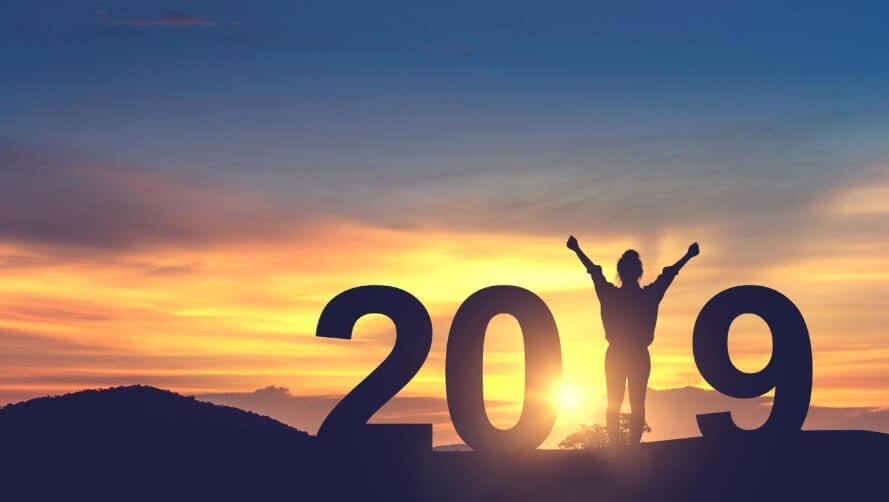 The numbers 2019 in front of a sunset