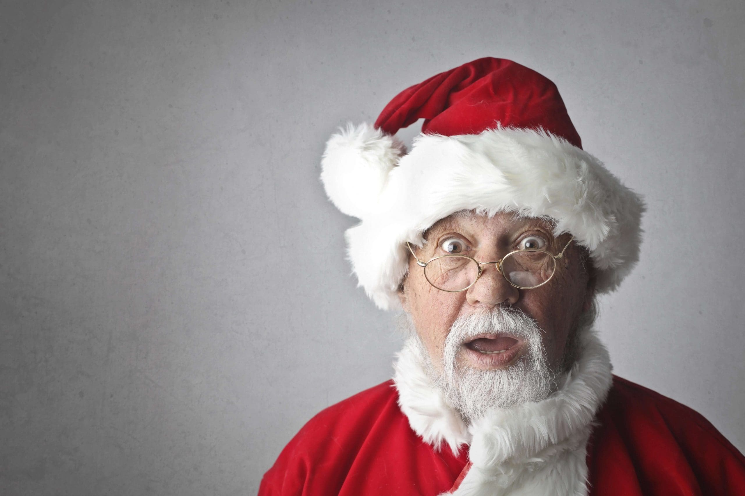 Elderly man dressed in Santa costume