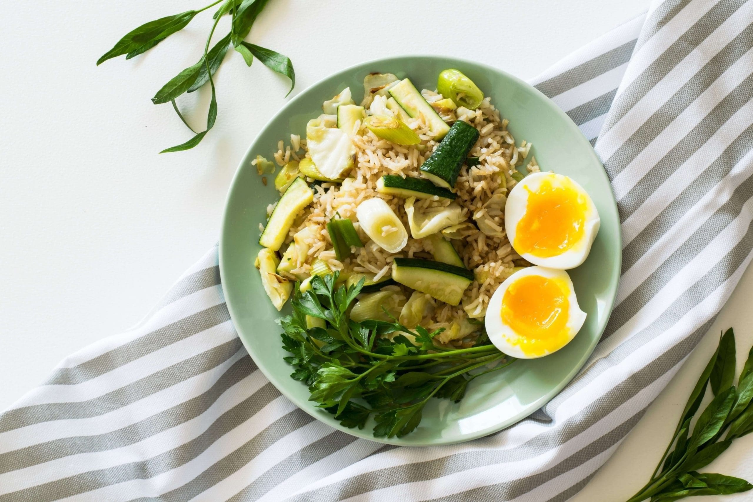 Meal of fried rice, egg and greens