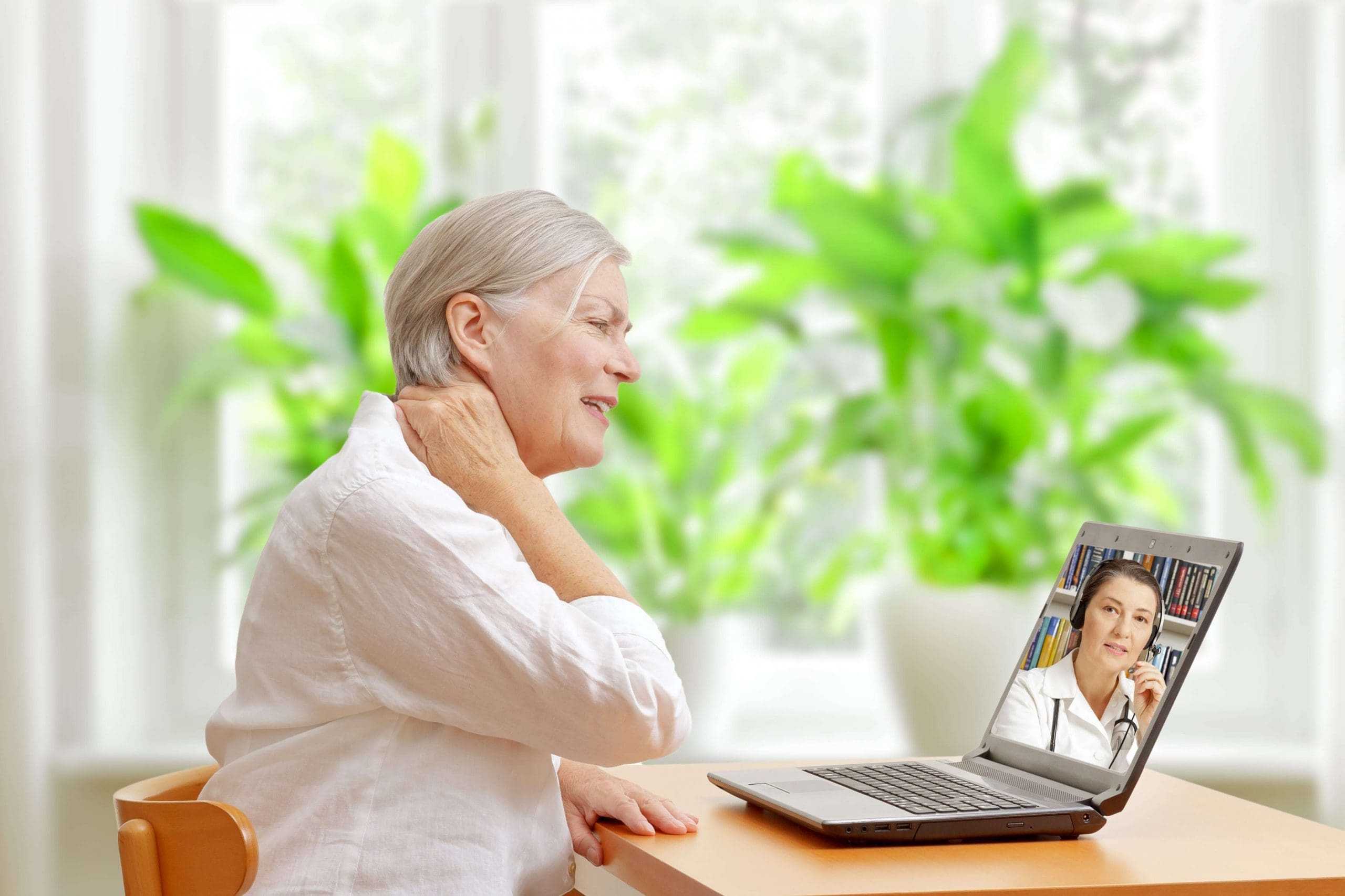 Senior woman attending a telehealth appointment from her home